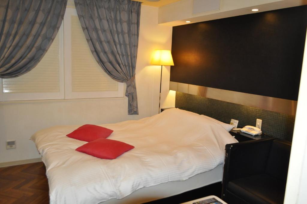 Postel nebo postele na pokoji v ubytování Hotel Woo (Adults Only)