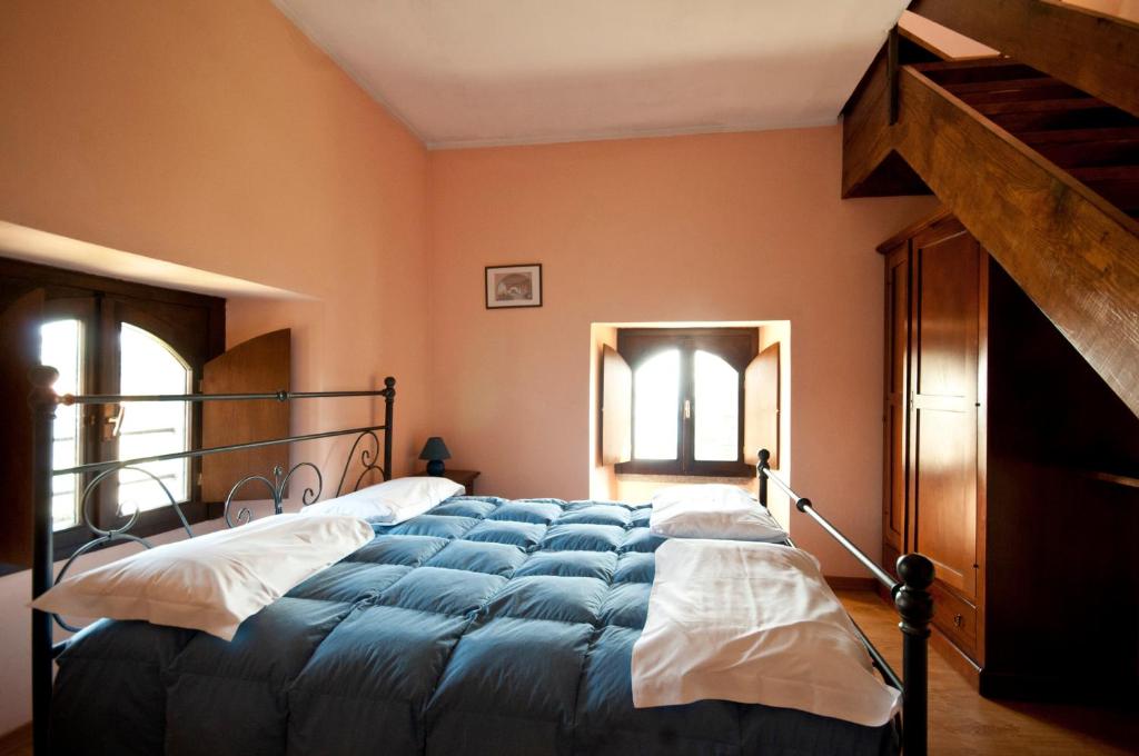 A bed or beds in a room at Agriturismo Monterosso