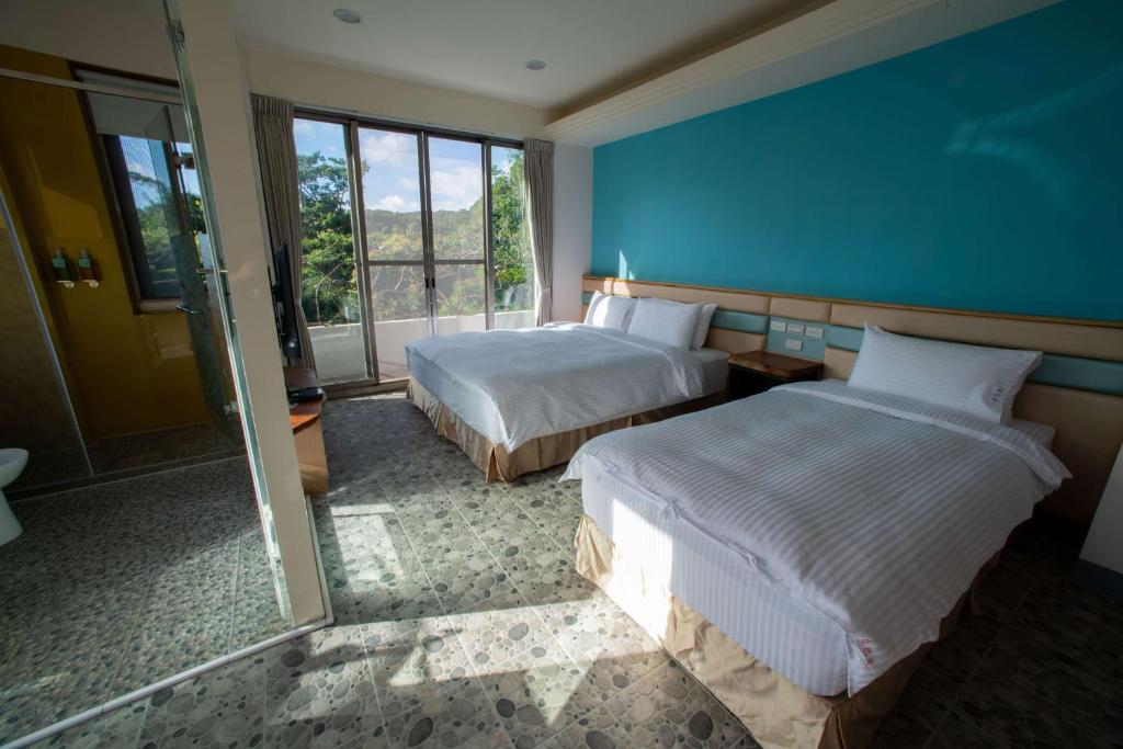 Letto o letti in una camera di Toptai Homestay