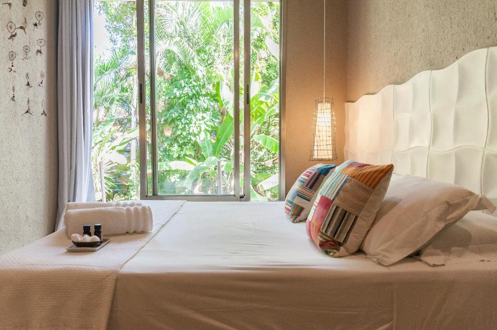 Postel nebo postele na pokoji v ubytování Mercatto Casa Hotel Boutique
