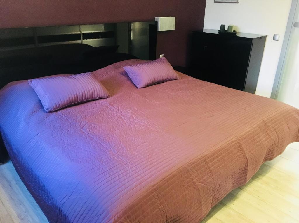 Posteľ alebo postele v izbe v ubytovaní Apartament Ala