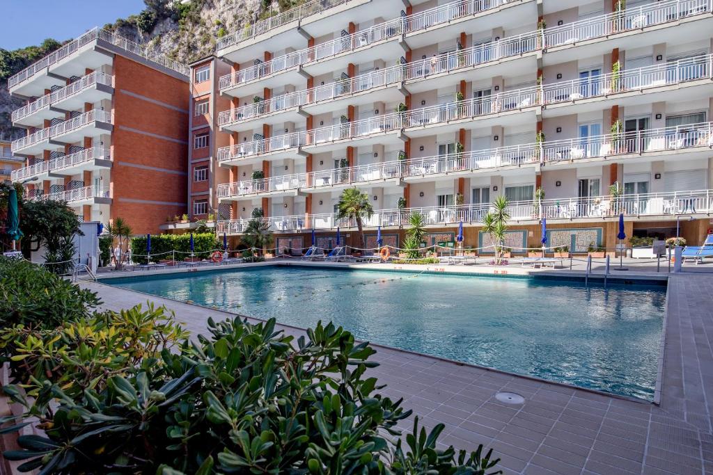 a large swimming pool in front of a building at Angelina Residence in Maiori