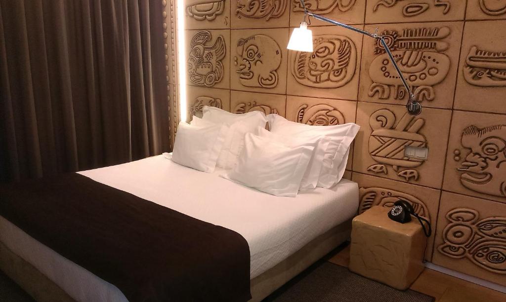 Postel nebo postele na pokoji v ubytování Hotel Fabrica do Chocolate