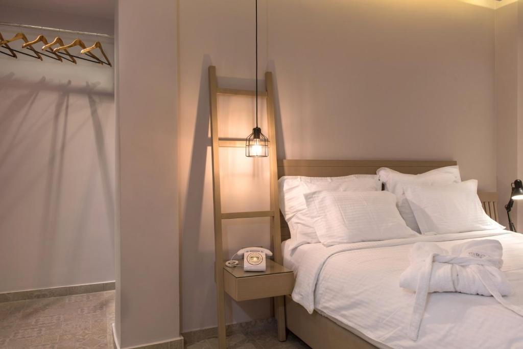 Postel nebo postele na pokoji v ubytování Pyrgos Hotel