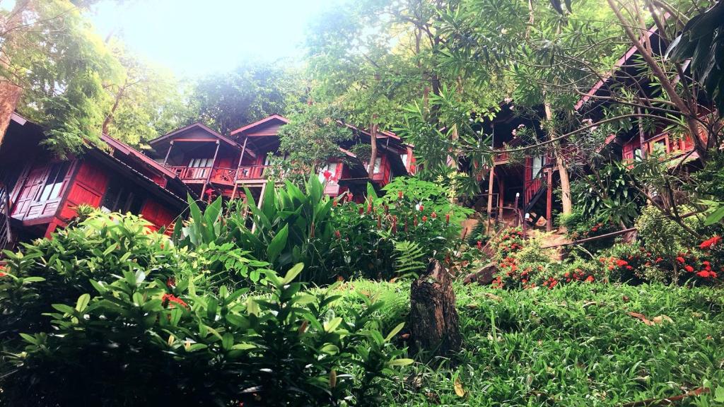 a group of houses with trees and plants at Phi Phi Green Hill Resort in Phi Phi Don