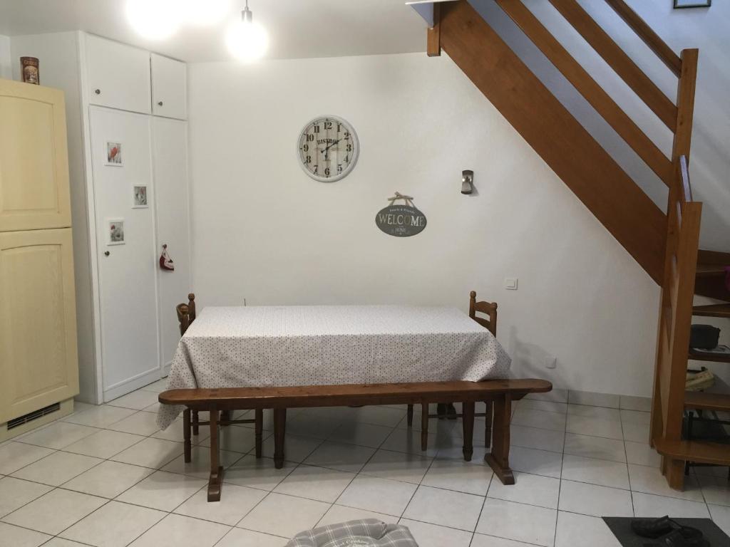 a bedroom with a bed and a staircase in a room at le 2018 in Cancale