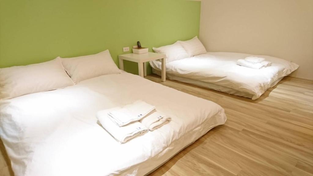 Postel nebo postele na pokoji v ubytování Ji Apartment