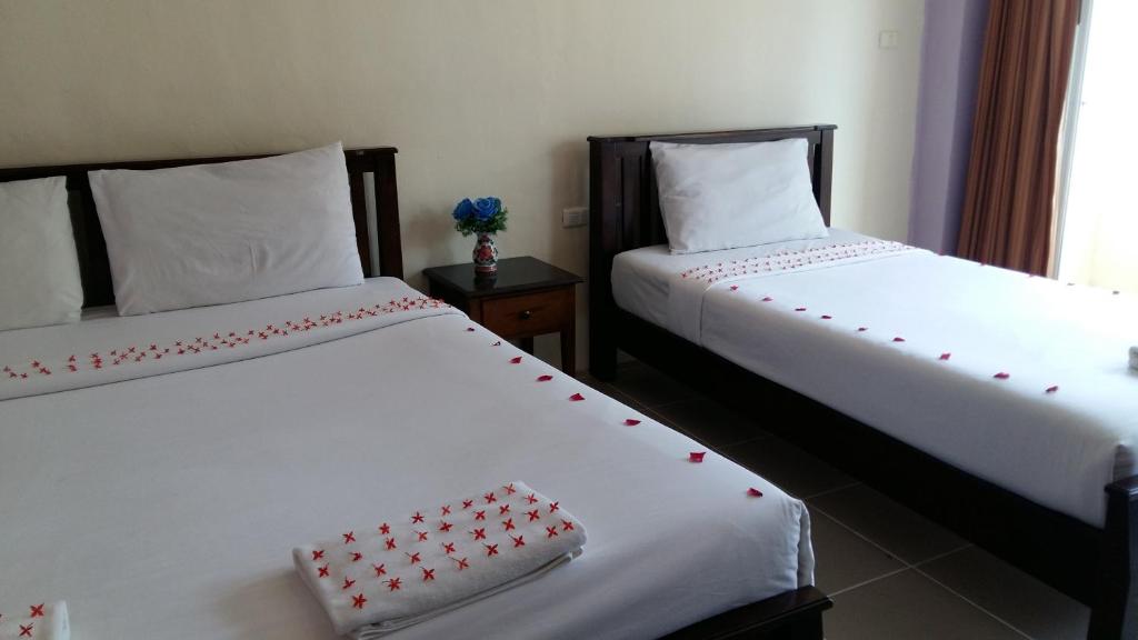 Postel nebo postele na pokoji v ubytování Number 1 Guesthouse