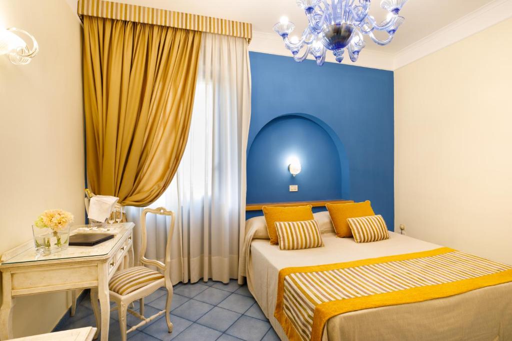 Postel nebo postele na pokoji v ubytování Hotel Zi' Teresa