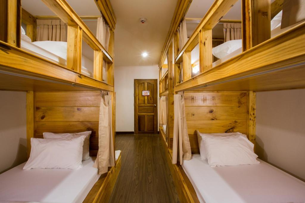 Postel nebo postele na pokoji v ubytování Nonnee Hotel Kata Beach Phuket