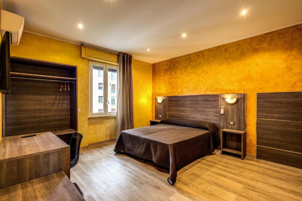Postel nebo postele na pokoji v ubytování Hotel Osimar