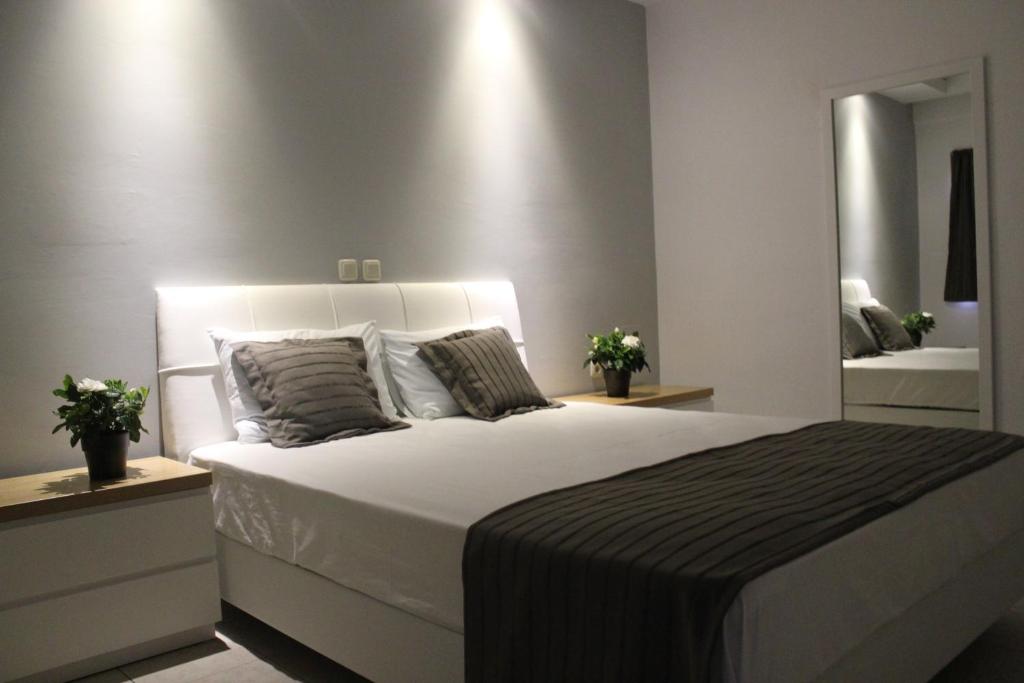 Postel nebo postele na pokoji v ubytování Zeus Hotel