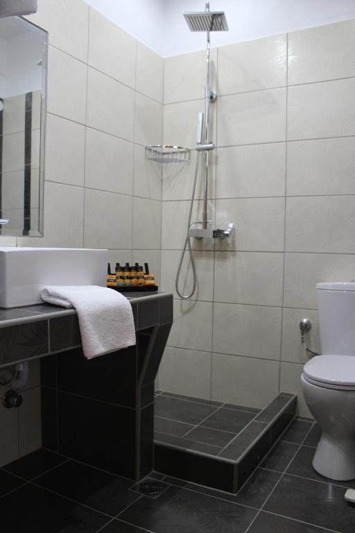 Koupelna v ubytování Zeus Hotel