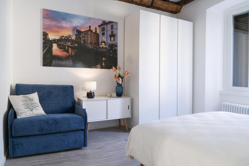 Posteľ alebo postele v izbe v ubytovaní MI HOME NAVIGLI