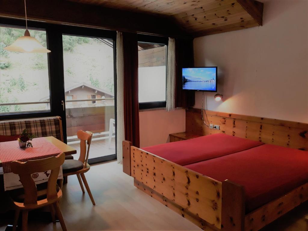 Łóżko lub łóżka w pokoju w obiekcie Alpina Residence