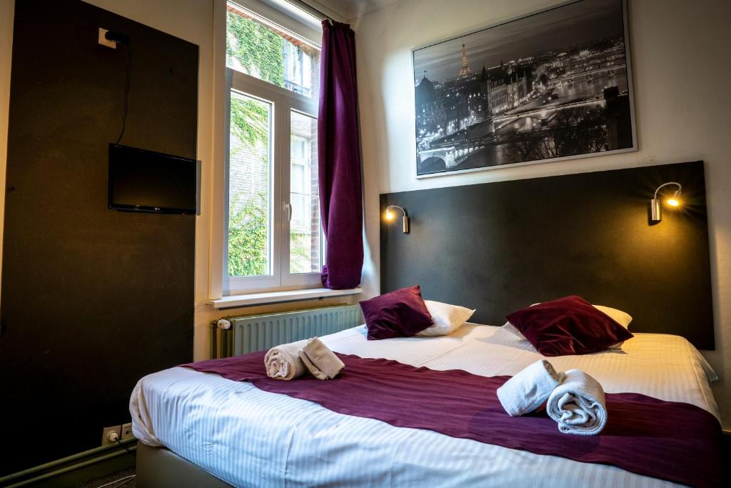 Postel nebo postele na pokoji v ubytování Flandria Hotel