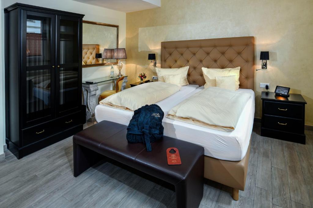 Postel nebo postele na pokoji v ubytování Hotel Heidelberger Hof