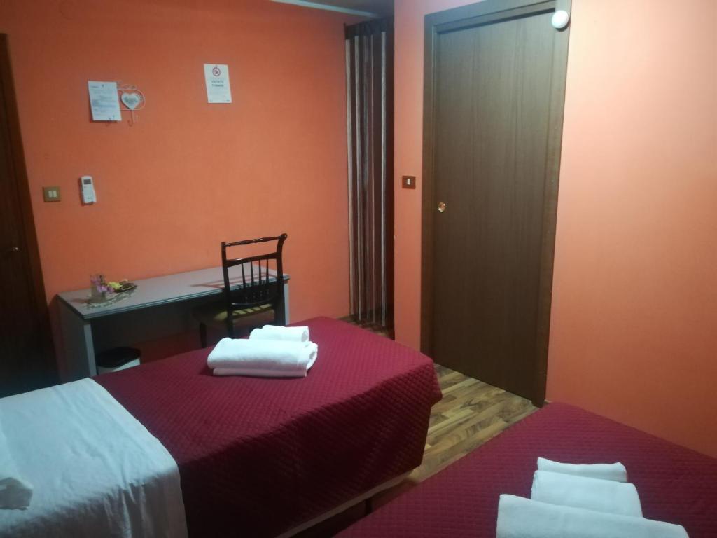 Postel nebo postele na pokoji v ubytování Le camille ristorante pizzeria & locanda