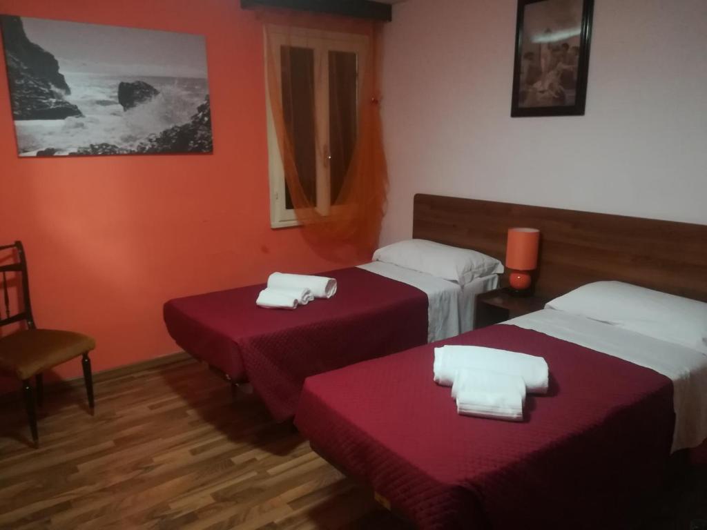 Postel nebo postele na pokoji v ubytování Le camille ristorante pizzeria & locanda