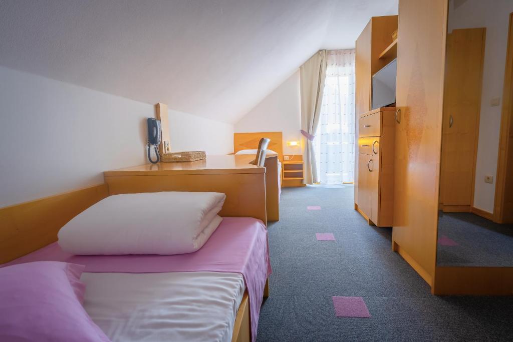 Postel nebo postele na pokoji v ubytování Villa Nena