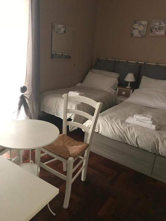 Łóżko lub łóżka w pokoju w obiekcie Morgagni House