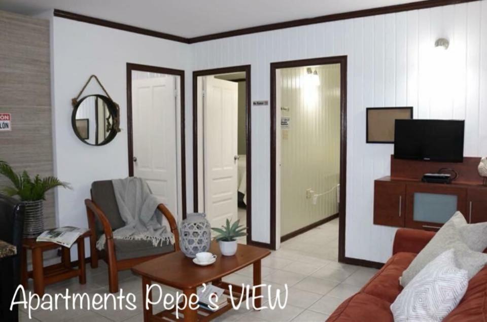 a living room with a couch and a table at Apartments Pepe's VIEW - A in Aguada