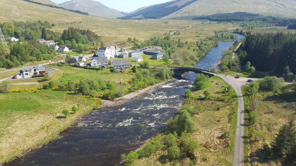 an aerial view of a river in a valley at Bridge of Orchy Hotel in Bridge of Orchy