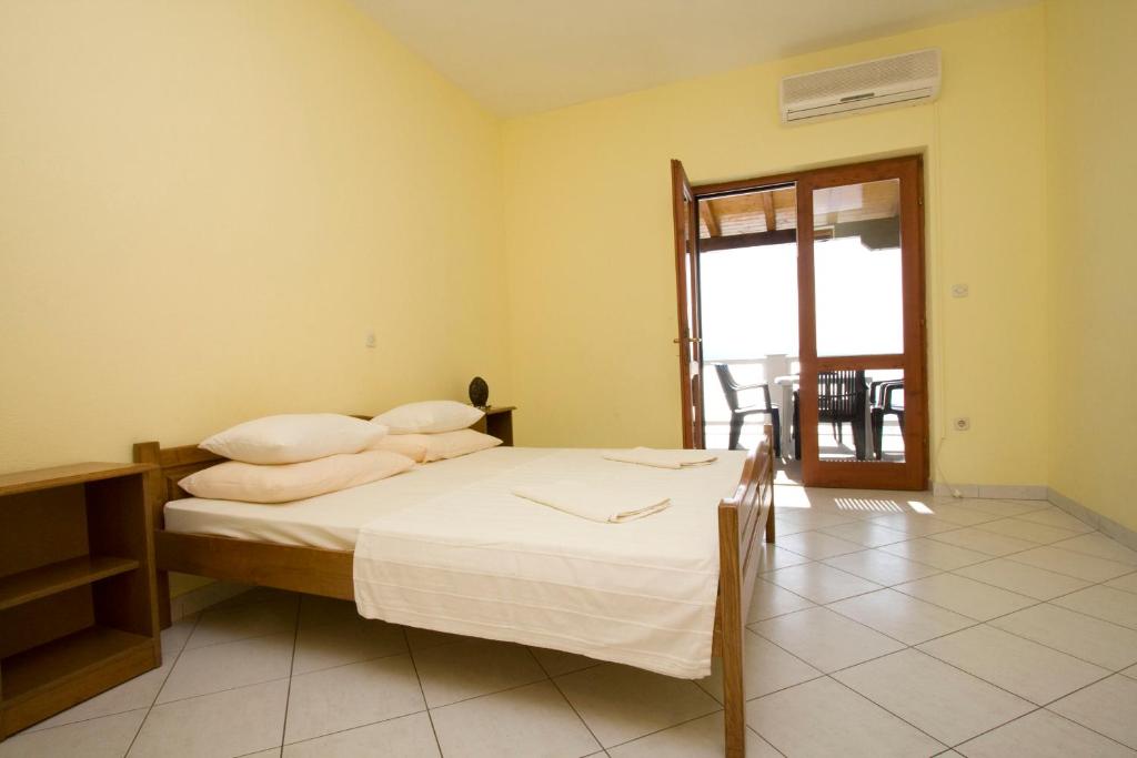 Posteľ alebo postele v izbe v ubytovaní Ella Apartments