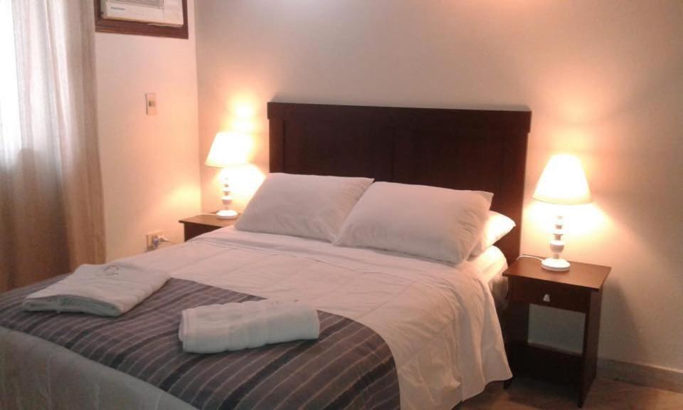 Postel nebo postele na pokoji v ubytování Sol de Luque Casa-hotel