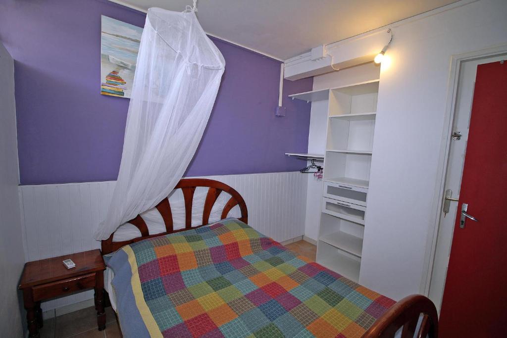 Postel nebo postele na pokoji v ubytování CHEZ JOJO