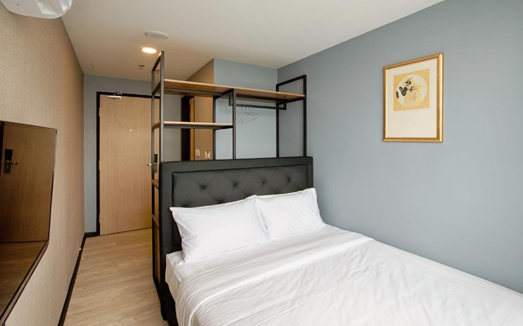 Postel nebo postele na pokoji v ubytování MTREE Hotel Nilai - KLIA Airport