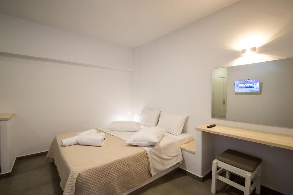 Postel nebo postele na pokoji v ubytování Hotel Galini Sifnos