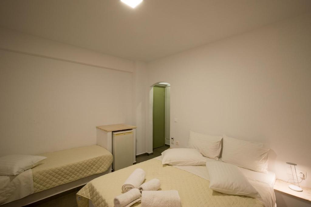 Postel nebo postele na pokoji v ubytování Hotel Galini Sifnos