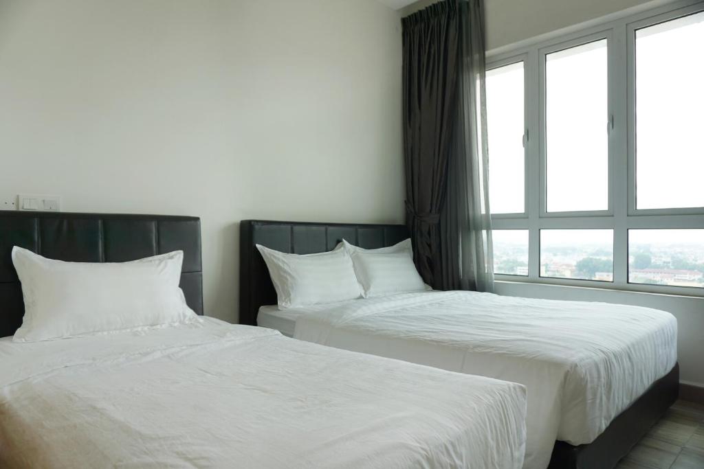 Postel nebo postele na pokoji v ubytování PM Octagon Ipoh Suites & Apartment 1