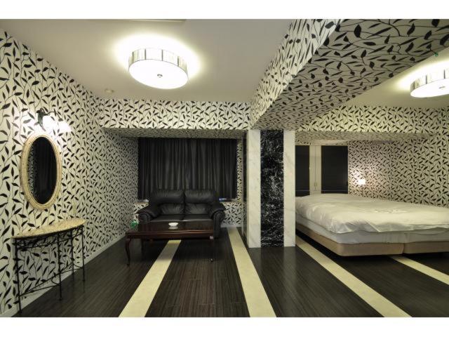Postel nebo postele na pokoji v ubytování Hotel ShaSha Resort Suma