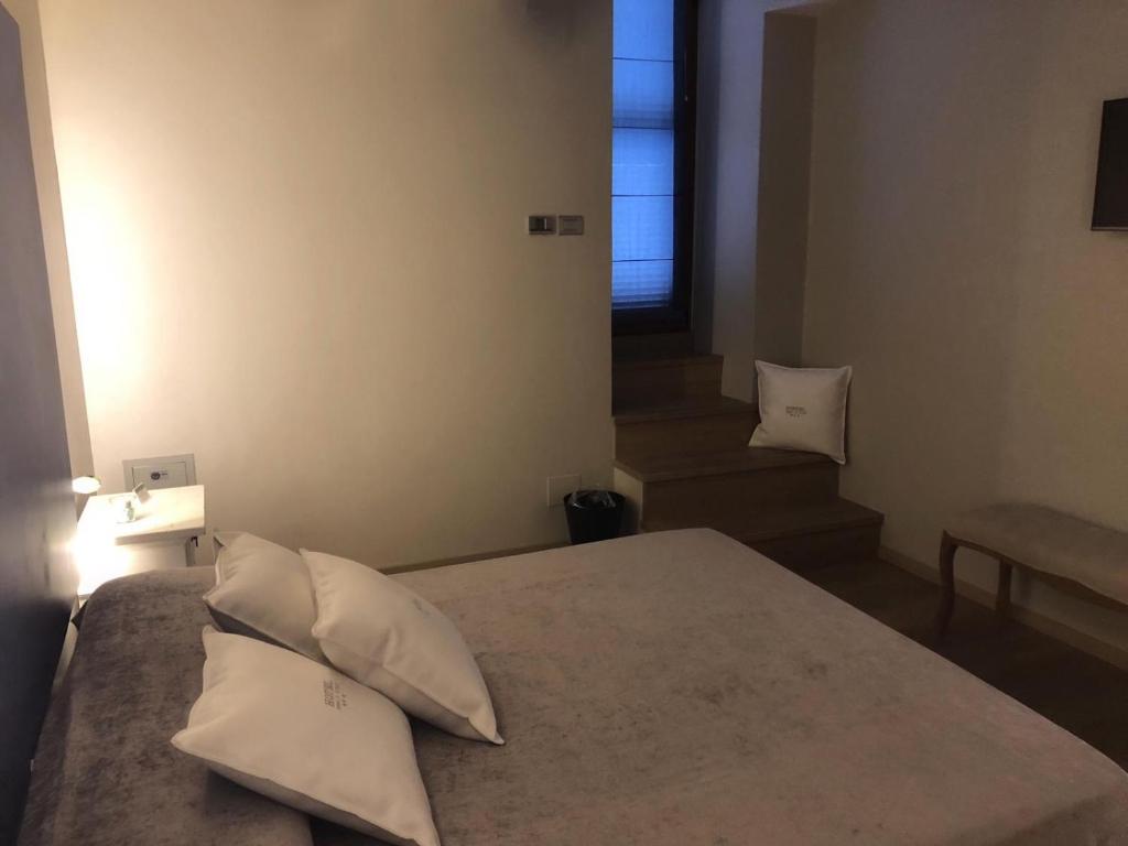 Postel nebo postele na pokoji v ubytování Hotel Tiro a Volo