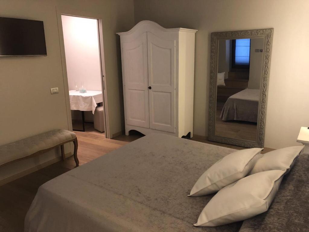 Postel nebo postele na pokoji v ubytování Hotel Tiro a Volo