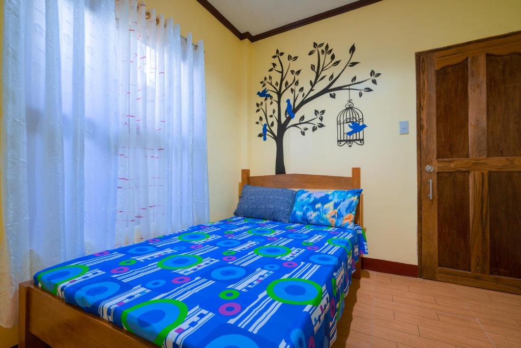 Postel nebo postele na pokoji v ubytování Joval Homestay