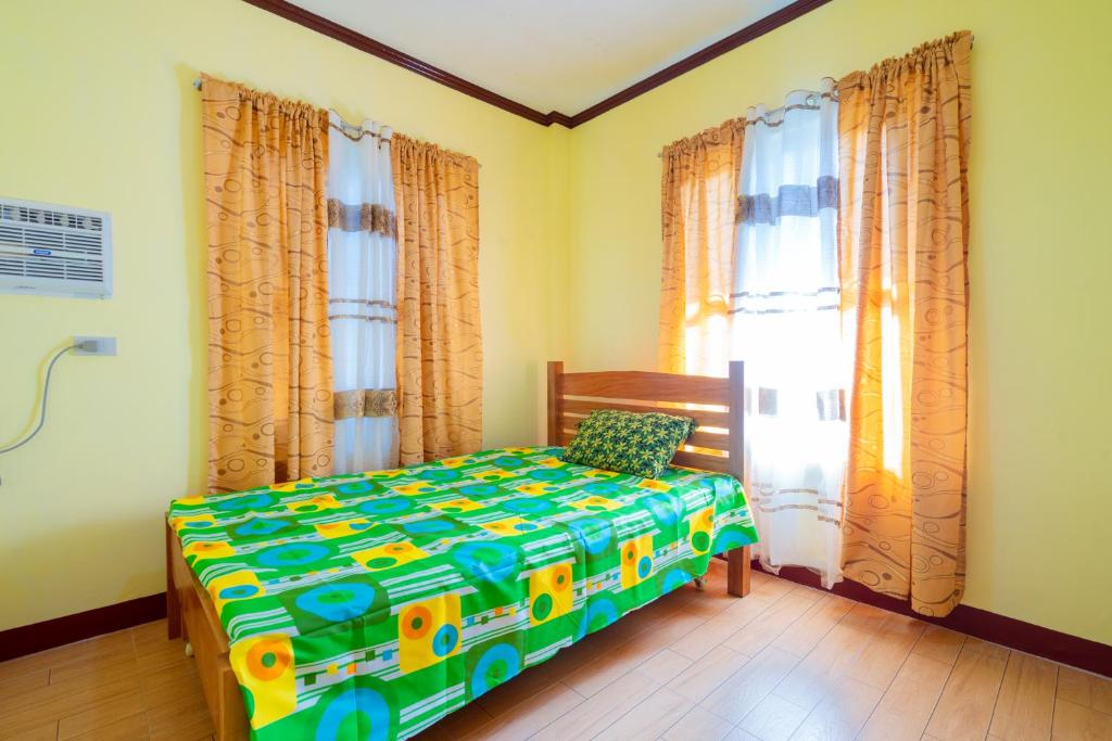 Postel nebo postele na pokoji v ubytování Joval Homestay