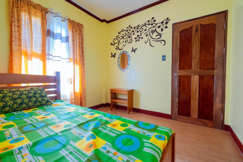 Postel nebo postele na pokoji v ubytování Joval Homestay
