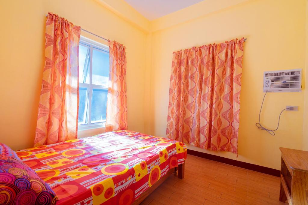 Postel nebo postele na pokoji v ubytování Joval Homestay