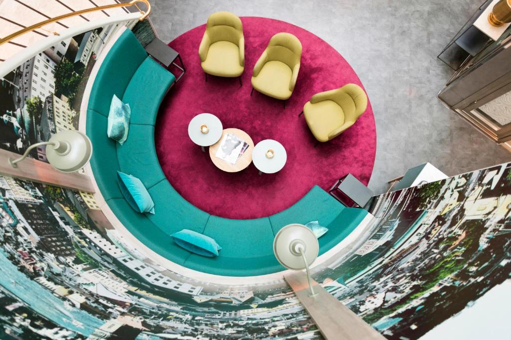 an overhead view of a table with chairs and food at ProfilHotels Central in Stockholm