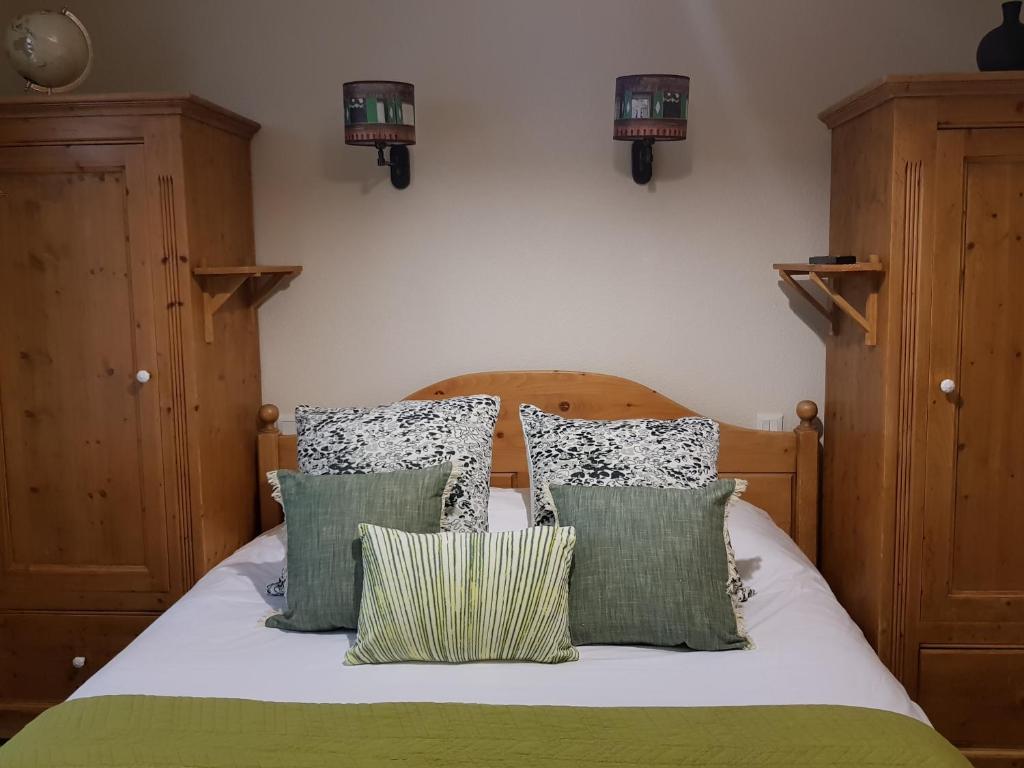 Postel nebo postele na pokoji v ubytování Lodge Hotel Les Rousses