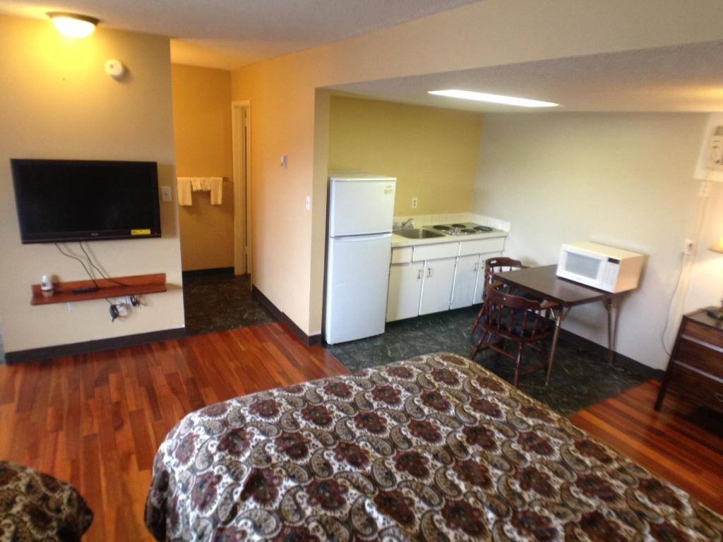 Kuchyň nebo kuchyňský kout v ubytování Galaxy Motel