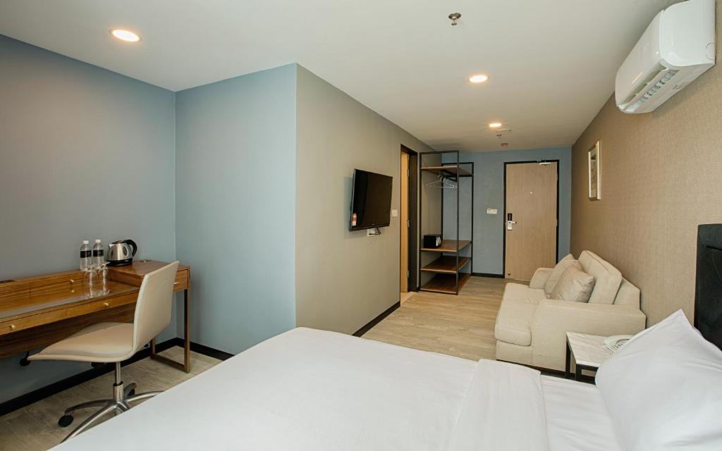 Postel nebo postele na pokoji v ubytování MTREE Hotel Nilai - KLIA Airport