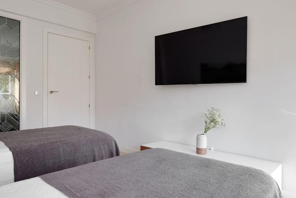 Posteľ alebo postele v izbe v ubytovaní Soroa Apartment