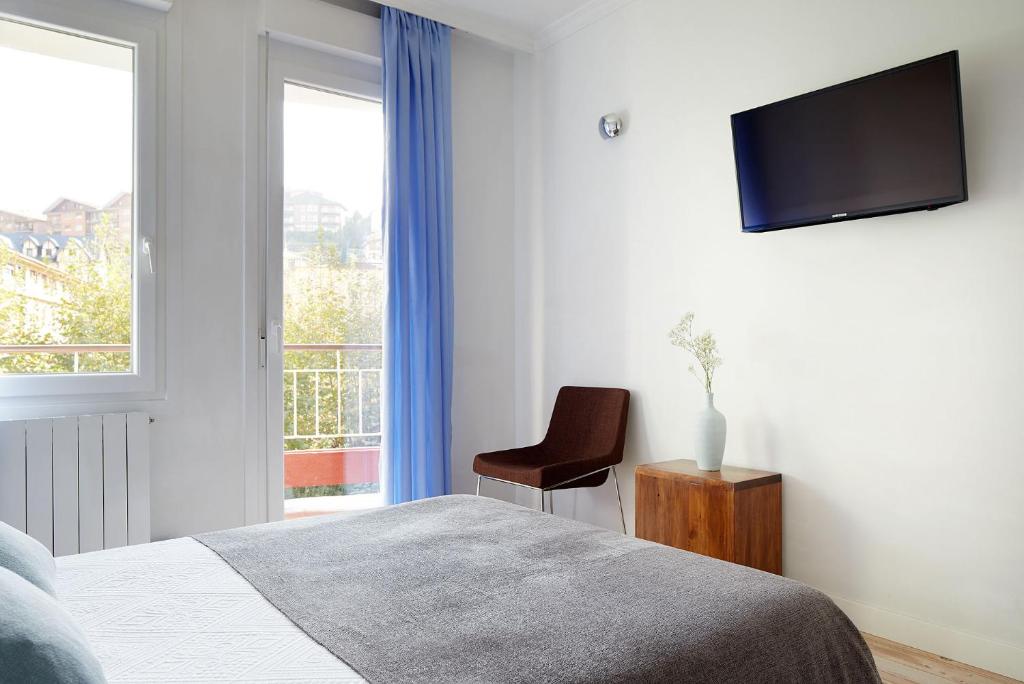 Posteľ alebo postele v izbe v ubytovaní Soroa Apartment