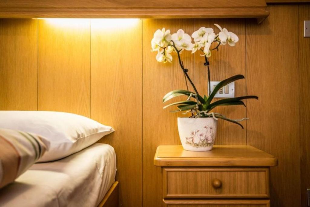 Posteľ alebo postele v izbe v ubytovaní Apartments Fiordalisi