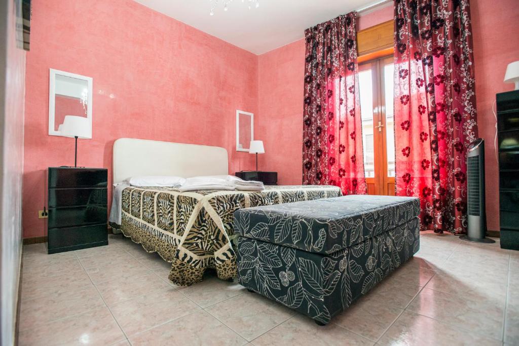 Łóżko lub łóżka w pokoju w obiekcie Sant'Antonio Garden Rooms Apartments