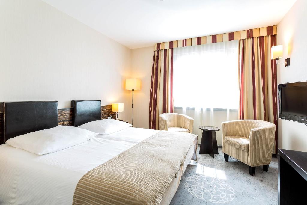 Postel nebo postele na pokoji v ubytování Qubus Hotel Kielce